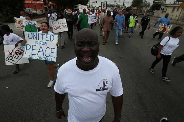 Marchers offer message of peace in a neighborhood marred by violence