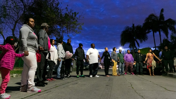 Family and friends hold vigil for man gunned down near his home